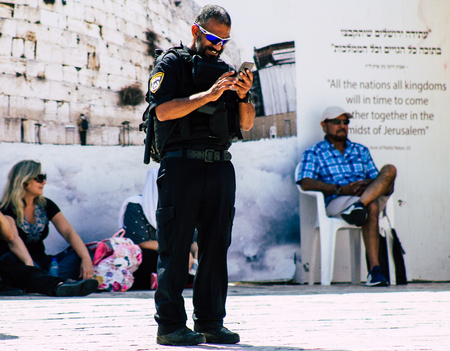 Jerusalem Israel July 2, 2019 View of Israeli police walking front the Western wall at the Old city of Jerusalem in the afternoonのeditorial素材