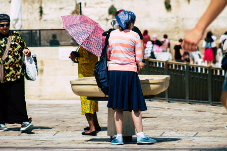 Jerusalem Israel July 2, 2019 View of unknown Israeli people drinking to the fountain located at the Western wall in the Old city of Jerusalem in the afternoonのeditorial素材