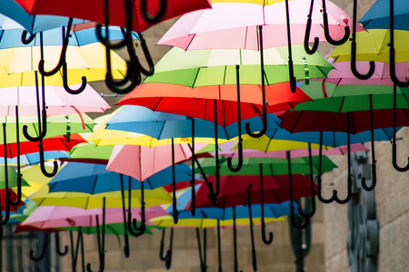 Jerusalem Israel July 2, 2019 Closeup of colorful umbrellas suspended by barely visible string over Yoel Moshe Solomon Street in the historic Nachalat Shiva district in Jerusalemのeditorial素材