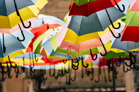 Jerusalem Israel July 2, 2019 Closeup of colorful umbrellas suspended by barely visible string over Yoel Moshe Solomon Street in the historic Nachalat Shiva district in Jerusalemのeditorial素材
