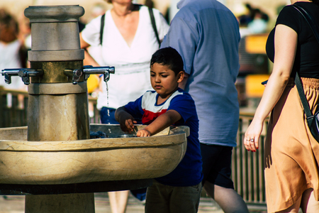 Jerusalem Israel July 2, 2019 View of unknown Israeli people drinking to the fountain located at the Western wall in the Old city of Jerusalem in the afternoonのeditorial素材