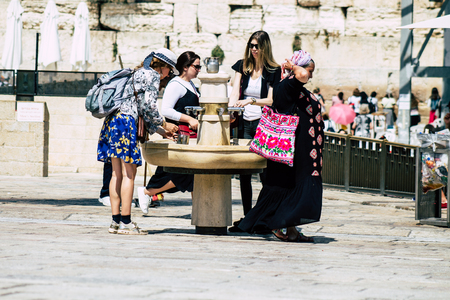 Jerusalem Israel July 2, 2019 View of unknown Israeli people drinking to the fountain located at the Western wall in the Old city of Jerusalem in the afternoonのeditorial素材