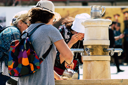 Jerusalem Israel July 2, 2019 View of unknown Israeli people drinking to the fountain located at the Western wall in the Old city of Jerusalem in the afternoonのeditorial素材