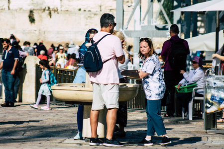 Jerusalem Israel July 2, 2019 View of unknown Israeli people drinking to the fountain located at the Western wall in the Old city of Jerusalem in the afternoonのeditorial素材