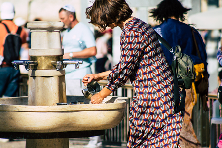 Jerusalem Israel July 2, 2019 View of unknown Israeli people drinking to the fountain located at the...