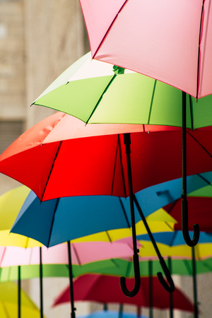 Jerusalem Israel July 2, 2019 Closeup of colorful umbrellas suspended by barely visible string over Yoel Moshe Solomon Street in the historic Nachalat Shiva district in Jerusalemのeditorial素材