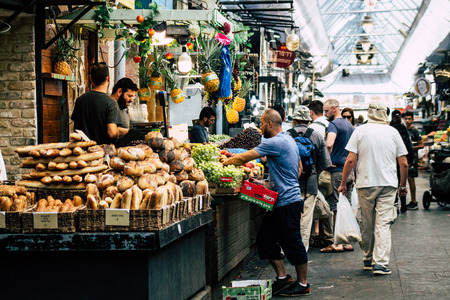 Jerusalem Israel July 3, 2019 View of unknown Israeli seller working at Mahane Yehuda Market in...
