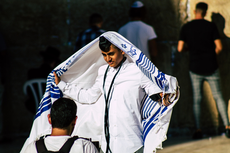 Jerusalem Israel July 3, 2019 View of young Israeli kid praying at the Western wall in the Old city of Jerusalem in the afternoonのeditorial素材
