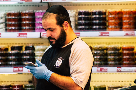 Jerusalem Israel July 3, 2019 View of unknown Israeli seller working at Mahane Yehuda Market in Jerusalem in the morningのeditorial素材