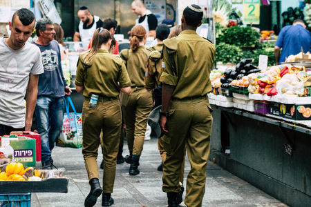 Jerusalem Israel July 3, 2019 View of unknown Israeli soldier walking and shopping at the Mahane Yehuda Market in Jerusalem in the morningのeditorial素材