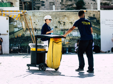 Jerusalem Israel July 3, 2019 View of unknown cleaner walking front the Western Wall at the Old city of Jerusalem in the morningのeditorial素材