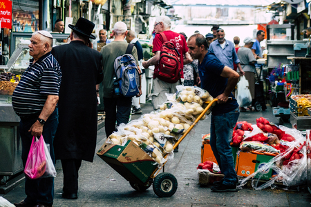 Jerusalem Israel July 3, 2019 View of unknown Israeli seller working at Mahane Yehuda Market in Jerusalem in the morningのeditorial素材