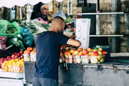 Jerusalem Israel July 3, 2019 View of unknown Israeli seller working at Mahane Yehuda Market in Jerusalem in the morningのeditorial素材