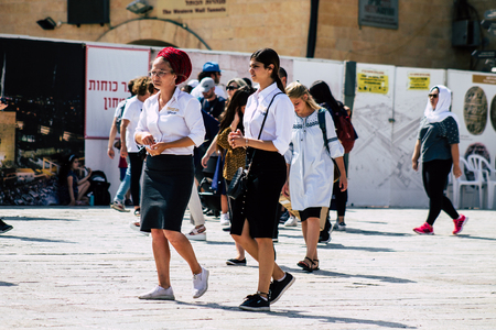 Jerusalem Israel July 4, 2019 View of unknown Israeli teen walking front the Western wall in the Old city of Jerusalem in the afternoonのeditorial素材
