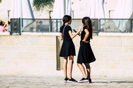 Jerusalem Israel July 4, 2019 View of unknown Israeli teen walking front the Western wall in the Old city of Jerusalem in the afternoonのeditorial素材