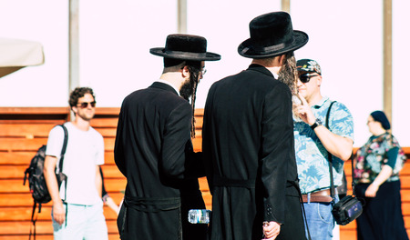 Jerusalem Israel July 4, 2019 View of unknown Israeli people walking front the Western wall in the Old city of Jerusalem in the afternoonのeditorial素材