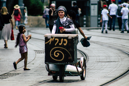 Jerusalem Israel July 4, 2019 View of unknown Israeli people rolling with a bicycle in Jaffa in Jerusalem in the afternoonのeditorial素材