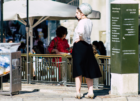 Jerusalem Israel July 4, 2019 View of unknown Israeli people walking front the Western wall in the Old city of Jerusalem in the afternoonのeditorial素材
