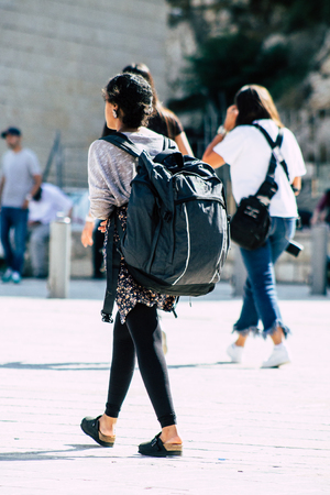 Jerusalem Israel July 4, 2019 View of unknown Israeli teen walking front the Western wall in the Old city of Jerusalem in the afternoonのeditorial素材