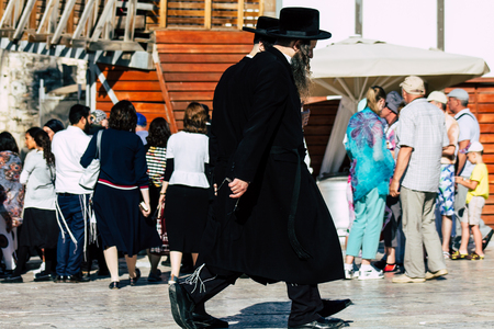 Jerusalem Israel July 4, 2019 View of unknown Israeli people walking front the Western wall in the Old city of Jerusalem in the afternoonのeditorial素材