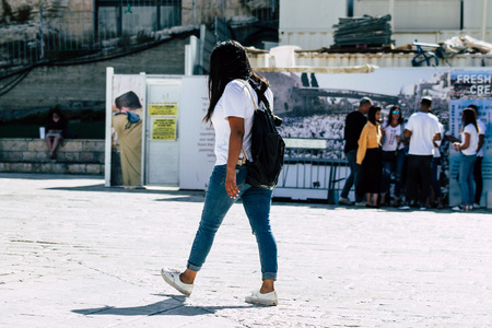 Jerusalem Israel July 4, 2019 View of unknown Israeli people walking front the Western wall in the Old city of Jerusalem in the afternoonのeditorial素材