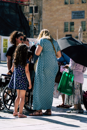 Jerusalem Israel July 4, 2019 View of unknown Israeli people walking front the Western wall in the Old city of Jerusalem in the afternoonのeditorial素材