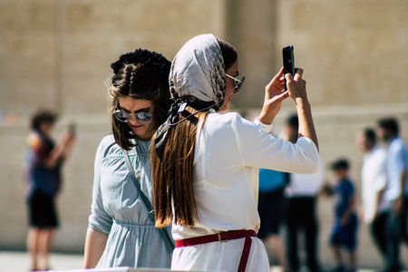 Jerusalem Israel July 4, 2019 View of unknown Israeli people walking front the Western wall in the Old city of Jerusalem in the afternoonのeditorial素材