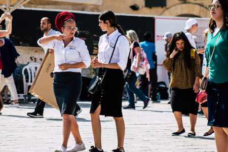 Jerusalem Israel July 4, 2019 View of unknown Israeli teen walking front the Western wall in the Old city of Jerusalem in the afternoonのeditorial素材