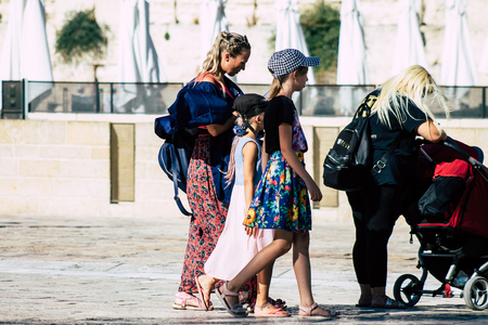 Jerusalem Israel July 4, 2019 View of unknown Israeli people walking front the Western wall in the Old city of Jerusalem in the afternoonのeditorial素材