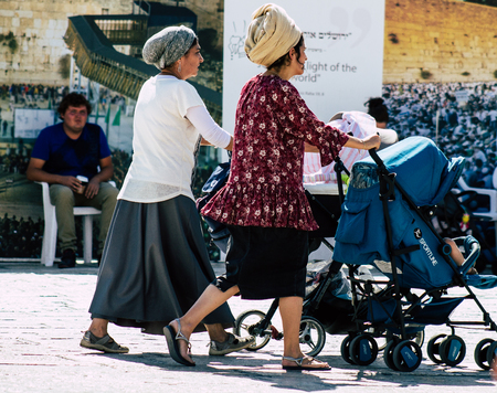 Jerusalem Israel July 4, 2019 View of unknown Israeli people walking front the Western wall in the Old city of Jerusalem in the afternoonのeditorial素材