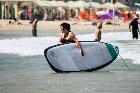 Tel Aviv Israel July 6, 2019 View of unknown Israeli people having fun on the beach of Tel Aviv during a sunny day in the afternoonのeditorial素材