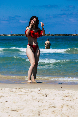 Tel Aviv Israel July 6, 2019 View of unknown teen having fun on the beach of Tel Aviv during a sunny day in the afternoonのeditorial素材