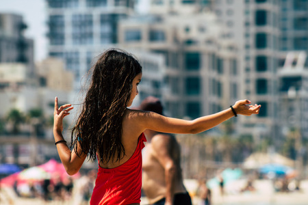 Tel Aviv Israel July 6, 2019 View of unknown Israeli child having fun on the beach of Tel Aviv during a sunny day in the afternoonのeditorial素材