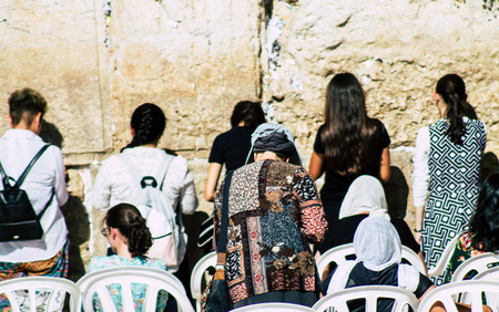 Jerusalem Israel June 24, 2019 View of unknown Israeli woman praying at the Western wall in the Old city of Jerusalem in the afternoonのeditorial素材