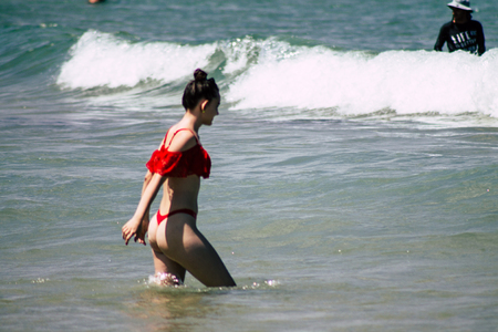 Tel Aviv Israel July 6, 2019 View of unknown teen having fun on the beach of Tel Aviv during a sunny day in the afternoonのeditorial素材