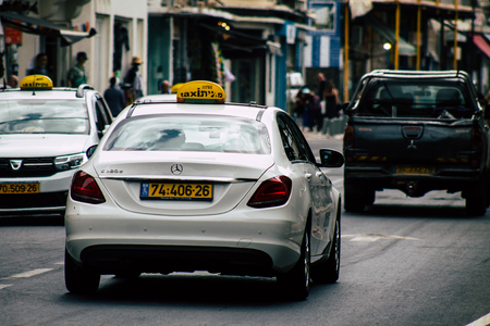 Tel Aviv Israel July 8, 2019 View of traditional Israeli taxi rolling in the streets of Tel Aviv in the afternoonのeditorial素材