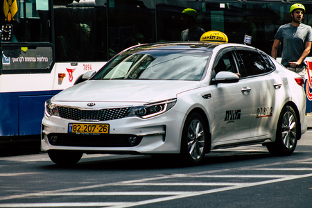 Tel Aviv Israel July 8, 2019 View of traditional Israeli taxi rolling in the streets of Tel Aviv in the afternoonのeditorial素材