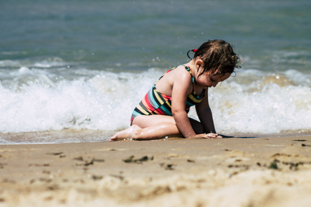 Tel Aviv Israel July 6, 2019 View of unknown Israeli child having fun on the beach of Tel Aviv during a sunny day in the afternoonのeditorial素材