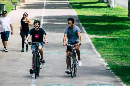 Tel Aviv Israel July 8, 2019 View of unknown Israeli people rolling with a bicycle in the streets of...