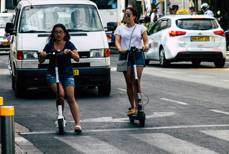 Tel Aviv Israel July 7, 2019 View of unknown Israeli people rolling with a electric scooter in the...