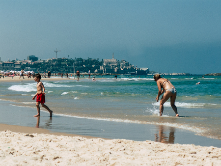 Tel Aviv Israel July 11, 2019 View of unknown Israeli people having fun on the beach of Tel Aviv during a sunny day in the afternoonのeditorial素材