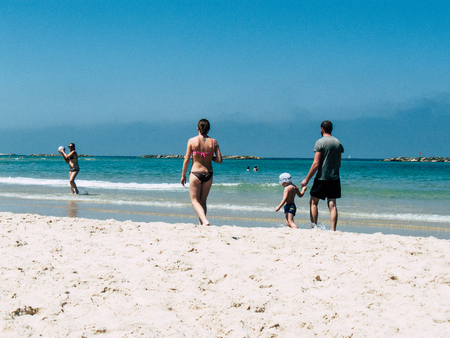 Tel Aviv Israel July 11, 2019 View of unknown Israeli people having fun on the beach of Tel Aviv during a sunny day in the afternoonのeditorial素材