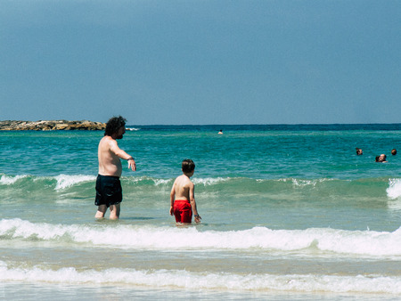 Tel Aviv Israel July 11, 2019 View of unknown Israeli people having fun on the beach of Tel Aviv during a sunny day in the afternoonのeditorial素材
