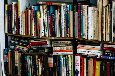 Tel Aviv Israel July 21, 2019 View of an ample selection of used Hebrew and English books in a warm, comfy space with a cafe and a patio located at The Little Prince bookshop in Tel Avivのeditorial素材