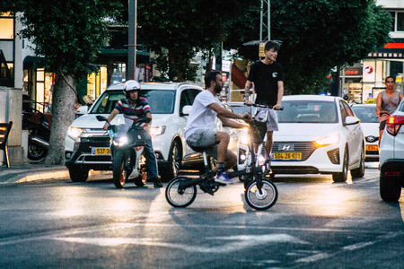 Tel Aviv Israel August 2, 2019 View of unknown people rolling with a bicycle in the streets of Tel Aviv in Israelのeditorial素材