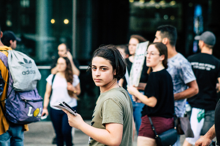 Tel Aviv Israel August 1, 2019 View of unknown Israeli people taking part in a political demonstration against the government of Benjamin Netanyahu in front of Azrieli Center in Tel Aviv in the early eveningのeditorial素材