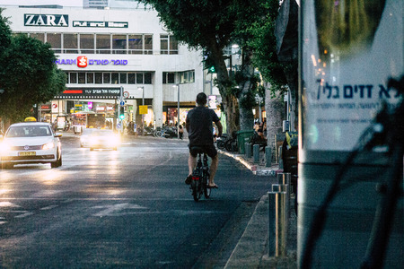 Tel Aviv Israel August 2, 2019 View of unknown people rolling with a bicycle in the streets of Tel Aviv in Israelのeditorial素材
