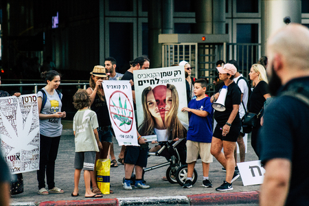 Tel Aviv Israel August 1, 2019 View of Israeli people taking part in a political demonstration against the government of Benjamin Netanyahu in front of Azrieli Center in Tel Aviv in the early eveningのeditorial素材