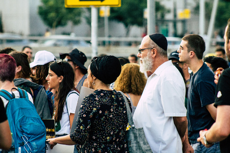 Tel Aviv Israel August 1, 2019 View of unknown Israeli people taking part in a political demonstration against the government of Benjamin Netanyahu in front of Azrieli Center in Tel Aviv in the early eveningのeditorial素材