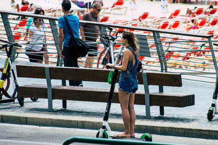 Tel Aviv Israel August 2, 2019 View of unknown Israeli people rolling with a electric scooters in the streets of Tel Aviv in the afternoonのeditorial素材